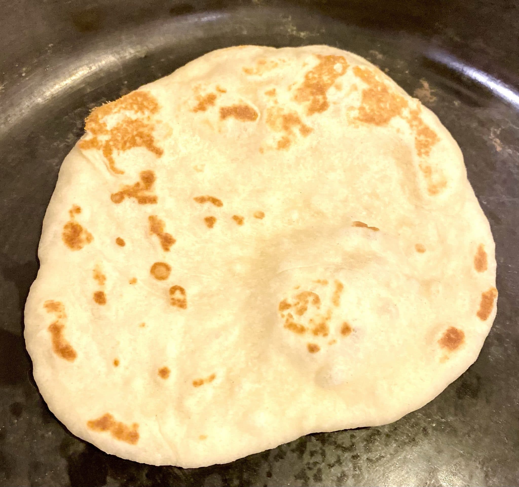 Freshly baked sourdough naan